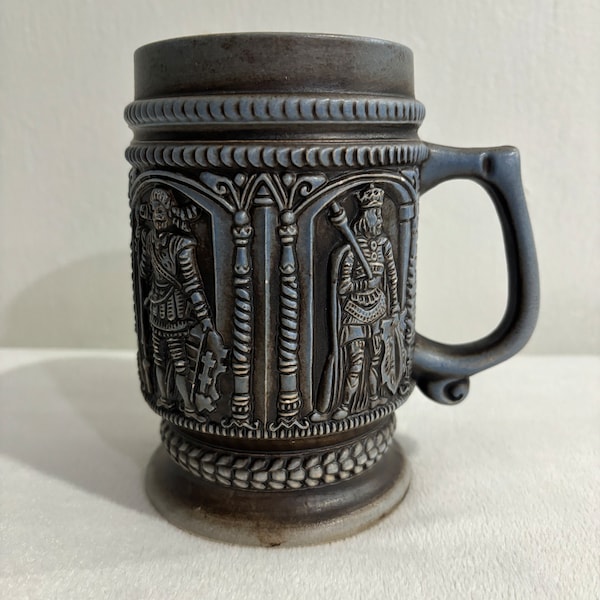 vintage Medevial times ceramic German beer stein/ mug with embossed knights.