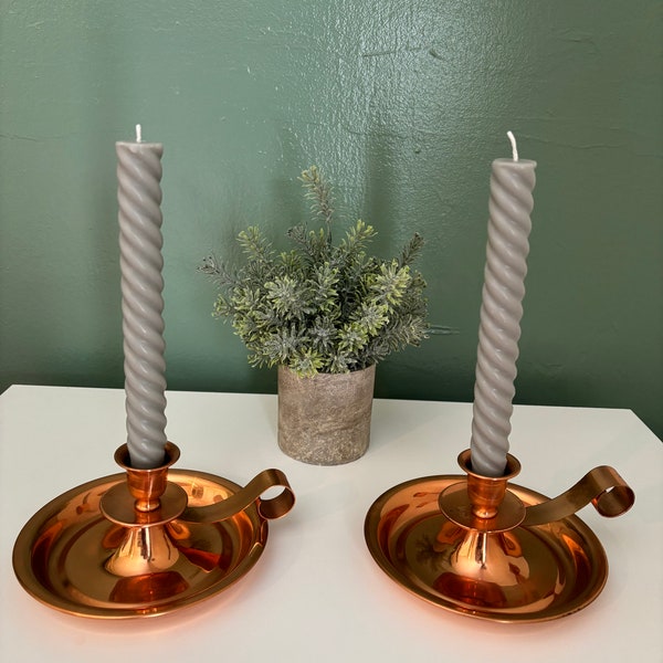 Two vintage Copral copper finger loop candle holders 6 1/2 inches wide