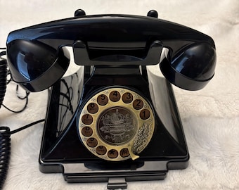 Vintage antique style black and gold rotary landline telephone