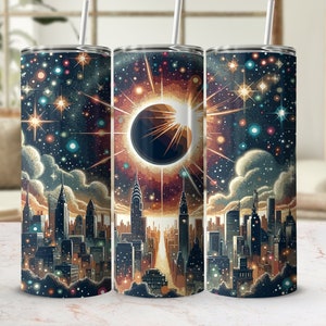 May include: Three stainless steel tumblers featuring a cityscape and a solar eclipse design. The tumblers are black with a starry night sky background and a cityscape silhouette in the foreground. The middle tumbler features a large solar eclipse in the centre.