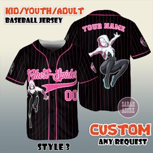 May include: Black baseball jersey with pink pinstripes, featuring a Ghost-Spider graphic. The jersey has the text "Ghost-Spider" and the number "00" on the front. The back of the jersey has a Ghost-Spider graphic and the text "YOUR NAME".