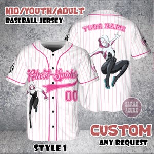 May include: White baseball jersey with pink pinstripes, featuring a Ghost-Spider graphic and the text "Ghost-Spider" and "00". The jersey includes the text "KID/YOUTH/ADULT BASEBALL JERSEY", "YOUR NAME", "CUSTOM ANY REQUEST", and "STYLE 1".