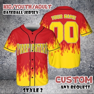 May include: Red and yellow baseball jersey with a flame design. The jersey has the word "FIREFIGHTERS" across the chest and the text "YOUR NAME" and the number "00" on the back. The jersey is labeled "STYLE 2" and "CUSTOM ANY REQUEST".