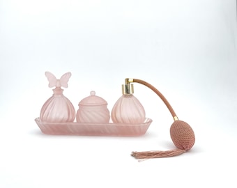 Pink glass vanity dresser set, perfume, cream jar, atomizer, 1970s