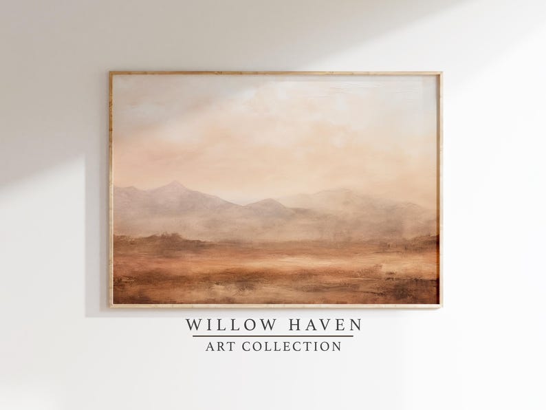 May include: A framed landscape painting with a warm color palette. The artwork depicts a mountain range in the distance, with a hazy sky and a foreground of earth tones. The text "WILLOW HAVEN ART COLLECTION" is at the bottom.