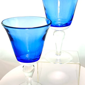 A vintage set of 2 cobalt blue blown glass water/wine goblets with clear base