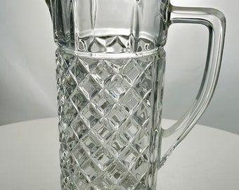 A vintage 6.5 inch crystal pitcher shaped creamer, 24 % lead crystal made by Zajecar in Yugoslavia, clear crystal with diamond pattern