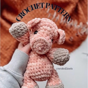 May include: A crocheted pig plush toy in pink and beige tones. The pig has a soft, textured finish with visible stitching. The text "CROCHET PATTERN" is arched above the pig. The account handle @neutral.knots is below the pig.