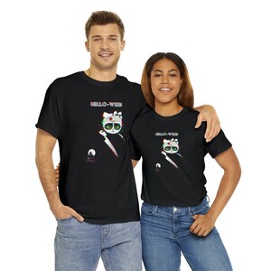 May include: Black t-shirts featuring a cartoon cat holding a knife, with the text "HELLO-WEEN". The cat has green eyes and a white bow. A small graphic of a moon and skull is also present.