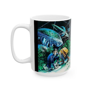 May include: White ceramic mug with a colorful illustration of a space scene. The scene features a spaceship, a planet, and a person in a blue spacesuit. The mug is a great gift for fans of science fiction.