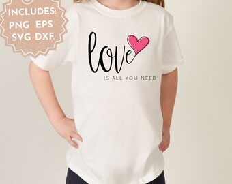 May include: White t-shirt with black text that reads "love is all you need" and a pink heart graphic.