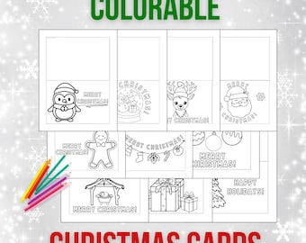 May include: A set of printable 2026 colorable Christmas cards featuring black and white line art illustrations of a penguin, snowman, reindeer, Santa, gingerbread man, ornaments, a nativity scene, and gifts, accompanied by a small set of colored pencils.