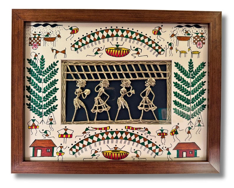 May include: A framed artwork depicting a traditional Indian folk art scene with a central panel of four figures playing instruments. The figures are made of brass wire and are set against a blue background. The surrounding artwork is painted in a whimsical style with figures, animals, and geometric patterns in shades of green, red, brown, and white.