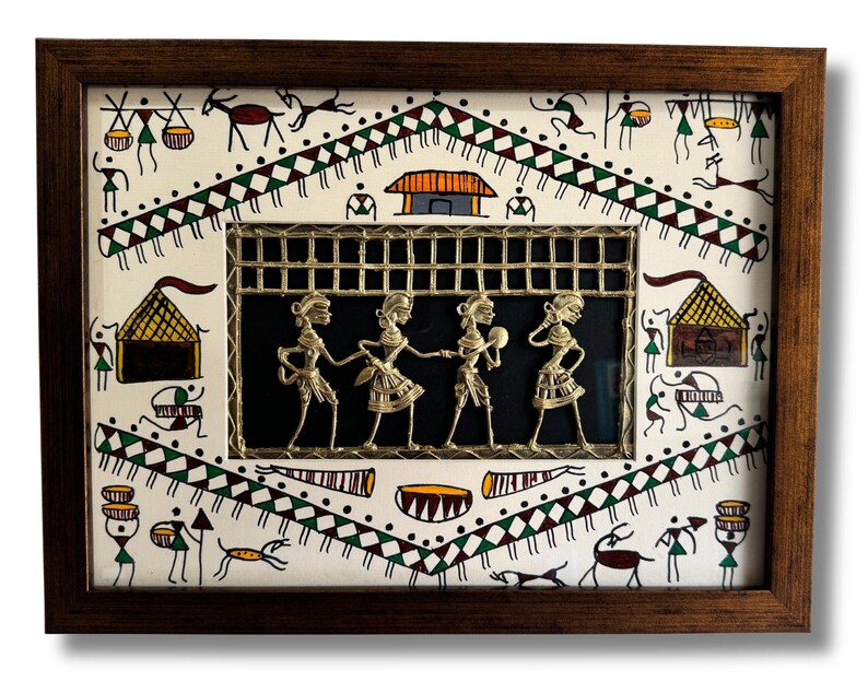 May include: A framed artwork featuring a traditional Indian folk art style with a white background and black and green geometric patterns. The centre of the artwork features a metal cutout of four figures in a dance pose, set against a black background.