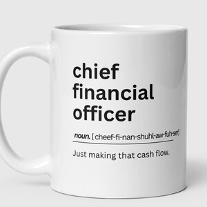 May include: White ceramic coffee mug with black text that reads "chief financial officer" and a phonetic pronunciation of the term. The text also includes "Just making that cash flow."