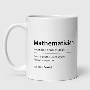 May include: White ceramic mug with a black graphic that defines the word "Mathematician" as a noun, with the pronunciation in brackets, and a humorous definition: "Counts stuff. Never wrong. Always awesome." The graphic also includes the text "see also: Daniel".