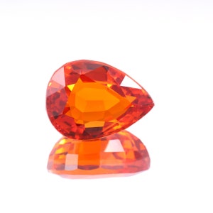 May include: A set of three ceramic mugs with a speckled, cream-colored glaze. Each mug features a different hand-painted floral design in shades of blue, green, and yellow. The mugs have a simple, rounded shape and a comfortable handle.