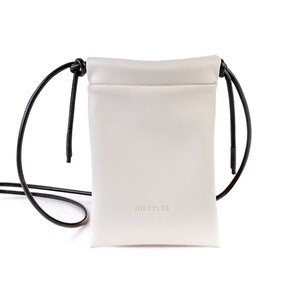 White vegan leather mini crossbody bag for men and women. A stylish accessory for every day to carry your basic essentials