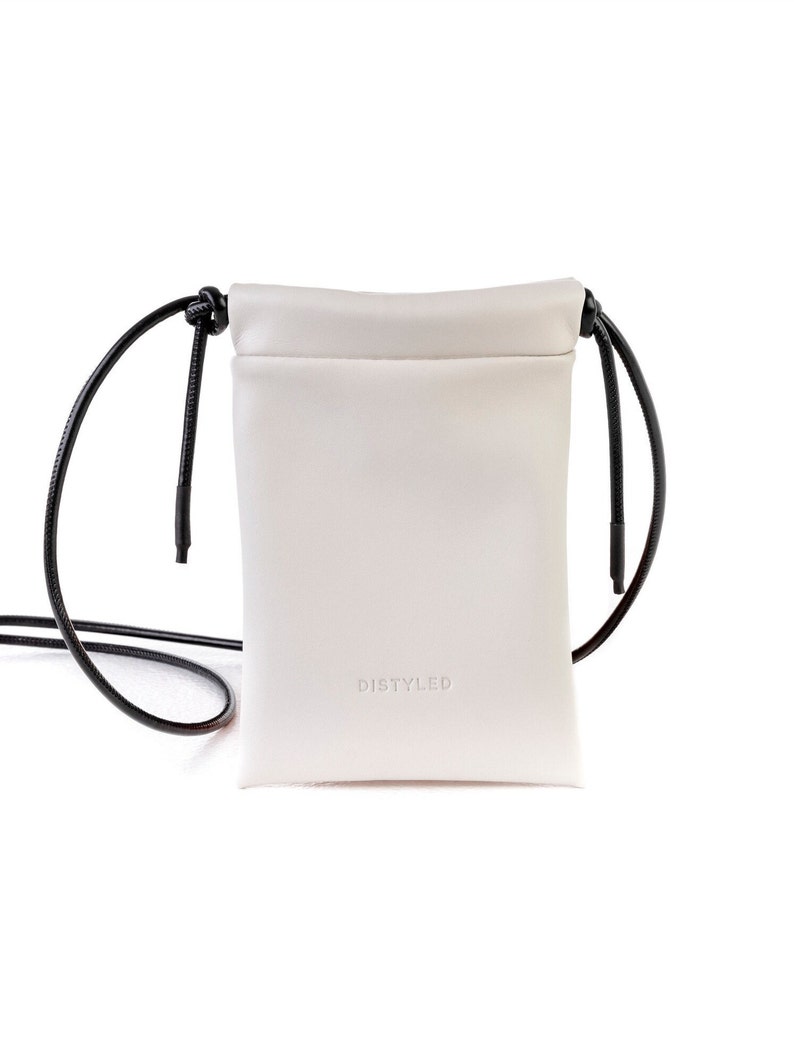 White vegan leather mini crossbody bag for men and women. A stylish accessory for every day to carry your basic essentials