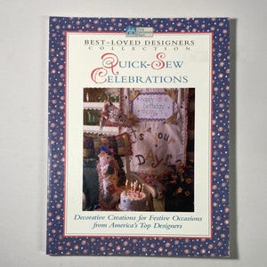 May include: A softcover book titled Quick-Sew Celebrations from the Best-Loved Designers Collection. The cover features a dark blue border with a white and pink polka dot pattern and a central photograph of a birthday cake and quilted wall hanging.