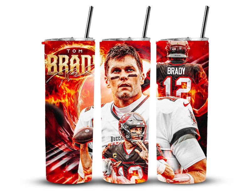 May include: A red, white, and black tumbler with a photo of Tom Brady on it. The tumbler has a straw and the text "TOM BRADY" on it.