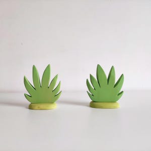 Perfect for Montessori and Waldorf-inspired play, this eco-friendly toy fosters creativity, fine motor skills, and a love for nature. Whether used as part of a tropical landscape playset or displayed as whimsical decor, the smooth, non-toxic finish.