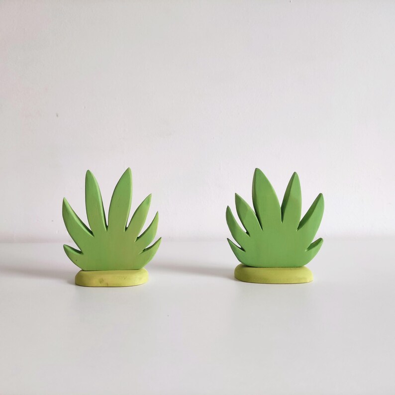 Perfect for Montessori and Waldorf-inspired play, this eco-friendly toy fosters creativity, fine motor skills, and a love for nature. Whether used as part of a tropical landscape playset or displayed as whimsical decor, the smooth, non-toxic finish.