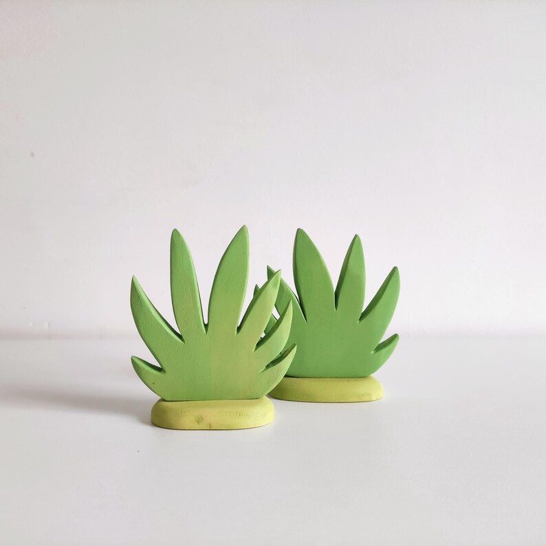 Perfect for Montessori and Waldorf-inspired play, this eco-friendly toy fosters creativity, fine motor skills, and a love for nature. Whether used as part of a tropical landscape playset or displayed as whimsical decor, the smooth, non-toxic finish.