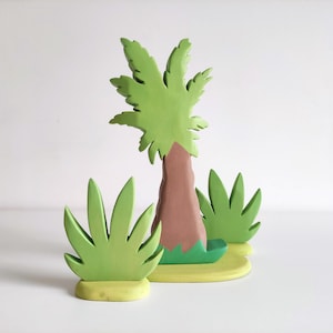 Perfect for Montessori and Waldorf-inspired play, this eco-friendly toy fosters creativity, fine motor skills, and a love for nature. Whether used as part of a tropical landscape playset or displayed as whimsical decor, the smooth, non-toxic finish.