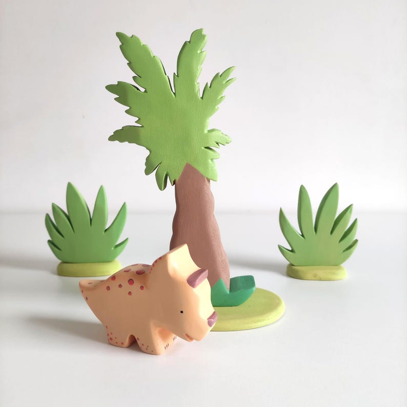 Perfect for Montessori and Waldorf-inspired play, this eco-friendly toy fosters creativity, fine motor skills, and a love for nature. Whether used as part of a tropical landscape playset or displayed as whimsical decor, the smooth, non-toxic finish.