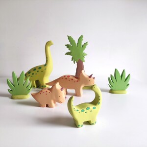 Perfect for Montessori and Waldorf-inspired play, this eco-friendly toy fosters creativity, fine motor skills, and a love for nature. Whether used as part of a tropical landscape playset or displayed as whimsical decor, the smooth, non-toxic finish.