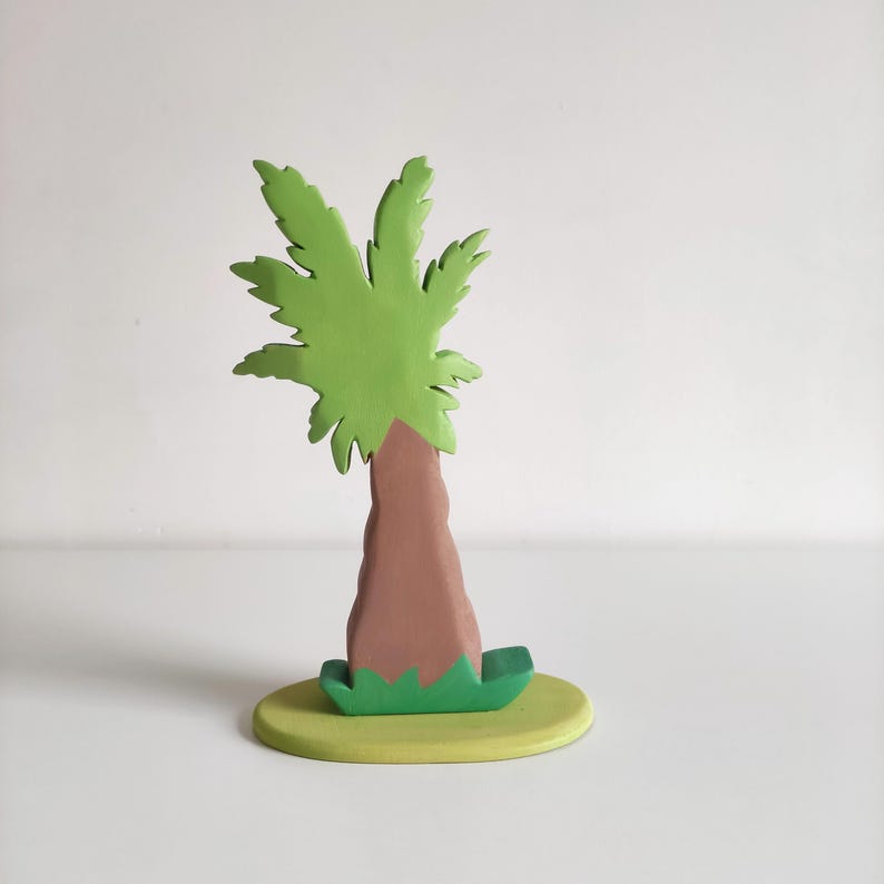 Perfect for Montessori and Waldorf-inspired play, this eco-friendly toy fosters creativity, fine motor skills, and a love for nature. Whether used as part of a tropical landscape playset or displayed as whimsical decor, the smooth, non-toxic finish.
