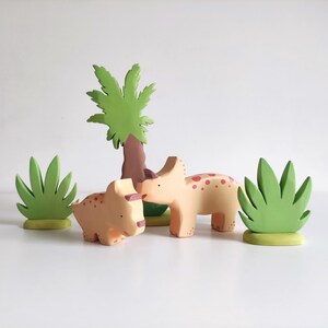 Perfect for Montessori and Waldorf-inspired play, this eco-friendly toy fosters creativity, fine motor skills, and a love for nature. Whether used as part of a tropical landscape playset or displayed as whimsical decor, the smooth, non-toxic finish.