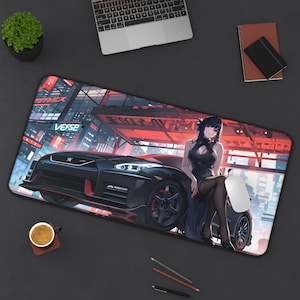 May include: A black and red gaming mouse pad with a black sports car and a woman in a black dress. The mouse pad has the word "Verse" printed on it.