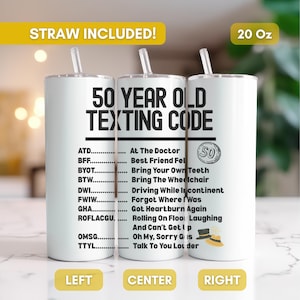 May include: Three white 20 oz tumblers with straws, each featuring the text "50 YEAR OLD TEXTING CODE" and a list of acronyms with their meanings. The tumblers have a yellow banner that says "STRAW INCLUDED!"