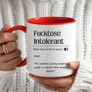 ceramic mug with red interior, bold black text that defines “Fucktose Intolerant” as someone unable to tolerate other people’s bullshit, ideal for sarcastic gift