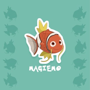 May include: A cartoon illustration of an orange and white fish with yellow fins and a white background. The fish has a large, round eye and a smiling mouth. The text "MAGIEMO" is written below the fish.