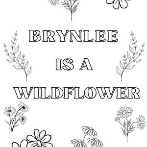 May include: Black and white line art design with the text "BRYNLEE IS A WILDFLOWER". The design includes various floral illustrations, such as daisies and sprigs of leaves, arranged around the text.
