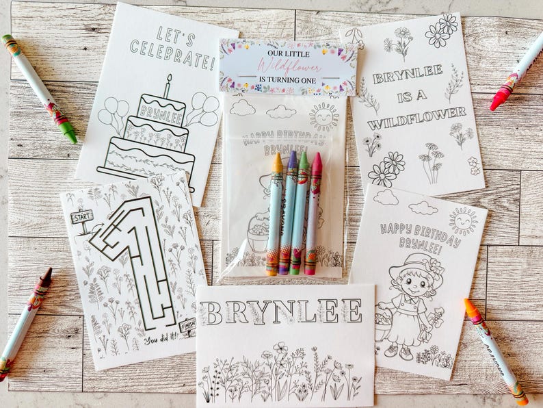 May include: A collection of coloring pages and crayons for a birthday celebration. The pages feature a cake, a maze, and the text "Let's Celebrate!" and "Happy Birthday Brynlee!" Crayons in various colors are scattered around the pages.
