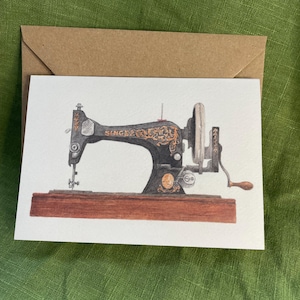 May include: A vintage black Singer sewing machine with gold accents and a wooden base. The machine has a hand crank and a needle.