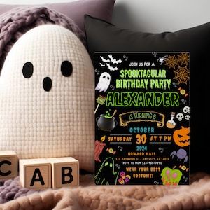 May include: A Halloween-themed birthday party invitation with the text "Spooktacular Birthday Party Alexander is turning 8". The invitation is black with orange and green accents, featuring ghosts, bats, and a pumpkin. A plush ghost and wooden blocks are in the foreground.