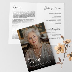 May include: A memorial service program with a portrait of a woman, the words "Forever Loved", and the name "Amanda Anderson." The program includes an obituary and order of service, with floral accents.