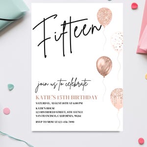 May include: A white invitation card with black text that reads "Fifteen" in a script font. The card has a pink and gold confetti theme with illustrations of balloons. The text on the card reads "Join us to celebrate Katie's 15th Birthday" and includes the date, time, location, and RSVP information.
