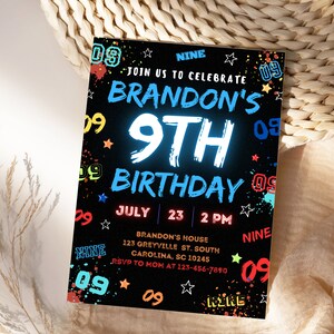 May include: A black and white birthday invitation with neon blue and red accents. The invitation says "Join us to celebrate Brandon's 9th Birthday" with the date and time of the party. The invitation is decorated with stars and the number "09" in various colors.