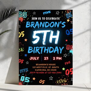 May include: A black and neon-colored birthday party invitation for a 5th birthday. The invitation features the text "Join us to celebrate Brandon's 5th Birthday" with a blue and white neon-style 5. The invitation also includes the date and time of the party, "July 23, 2 PM", and the location, "Brandon's House, 123 Greyville St. South, Carolina, SC 10245".