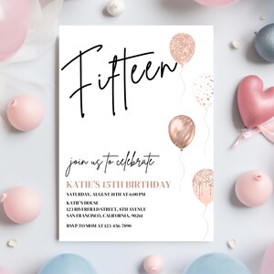 May include: A white invitation card with black text that reads "Fifteen" and "join us to celebrate KATIE'S 15TH BIRTHDAY". The invitation includes details for the party, including the date, time, location, and RSVP information. The card is decorated with rose gold glitter balloons.