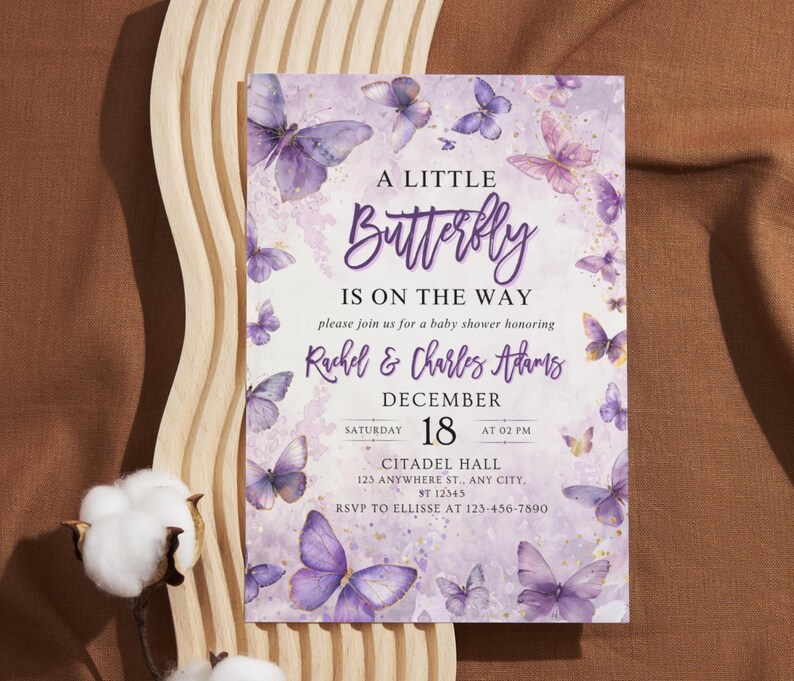 May include: A baby shower invitation with a butterfly theme. The invitation features a purple and white color scheme with butterfly illustrations. The text reads "A Little Butterfly Is On The Way" and includes event details.