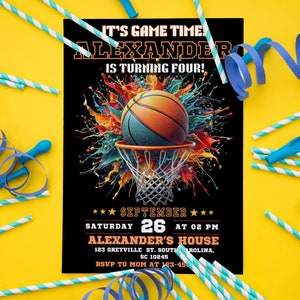 May include: A basketball-themed birthday invitation with a black background and colorful paint splatters. The invitation features a basketball going through a hoop with the text "It's Game Time! Alexander is turning four!" and "Saturday September 26 at 02 PM Alexander's House 123 Greyville St. South Carolina, SC 10245 RSVP to Mom at 123-45".
