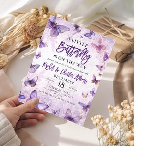 May include: A baby shower invitation with a purple butterfly theme. The invitation reads "A Little Butterfly Is On The Way" and includes the names Rachel & Charles Adams, the date December 18, and event details.