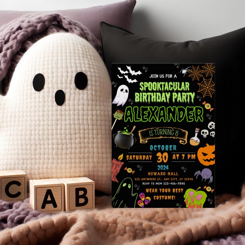 May include: A Halloween-themed birthday party invitation with the text "Spooktacular Birthday Party Alexander is turning 8". The invitation is black with orange and green accents, featuring ghosts, bats, and a pumpkin. A plush ghost and wooden blocks are in the foreground.